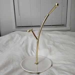 White and gold necklace holder